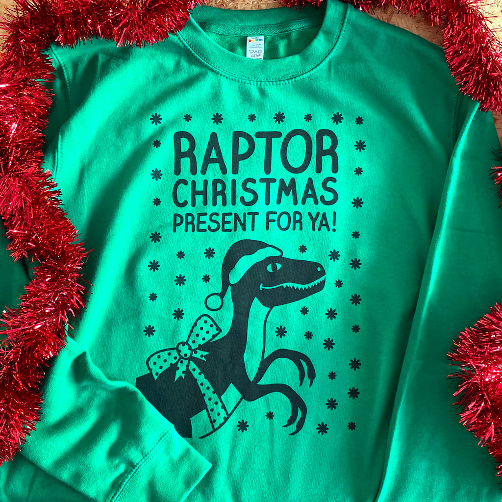 ‘Raptor Christmas Present For Ya’ Dinosaur Christmas Jumper